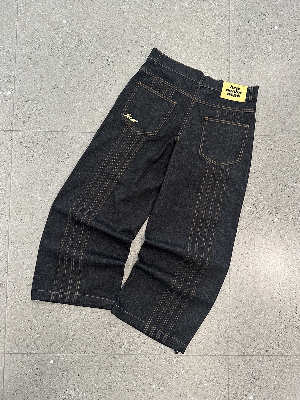 Raw Denim Jeans With Visible Stitching