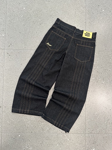 Raw Denim Jeans With Visible Stitching